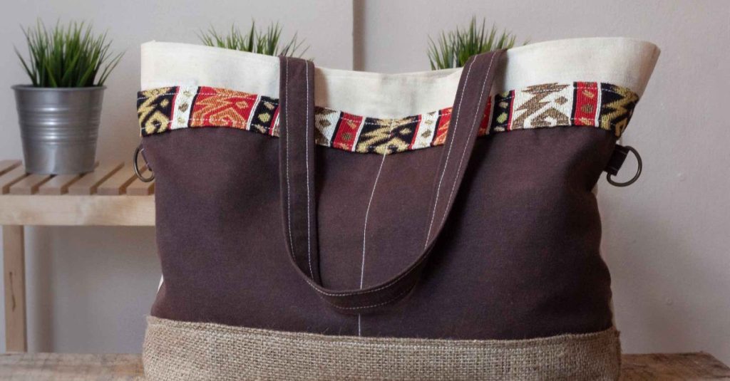 Fashionable canvas tote bag featuring colorful ethnic patterns, perfect for daily use.