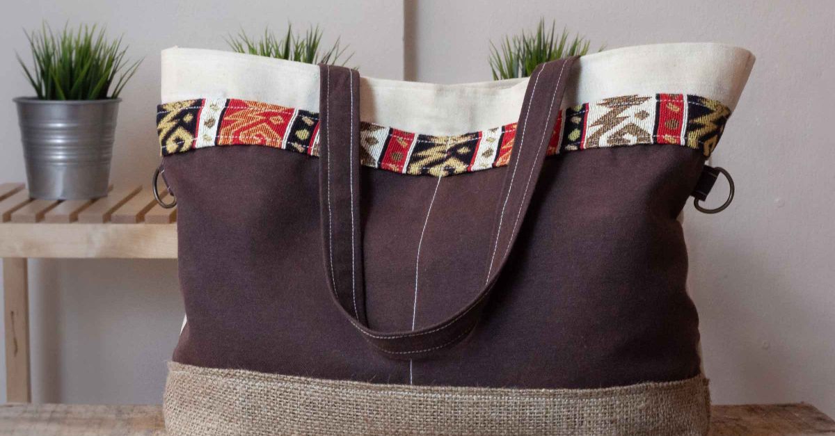 Fashionable canvas tote bag featuring colorful ethnic patterns, perfect for daily use.