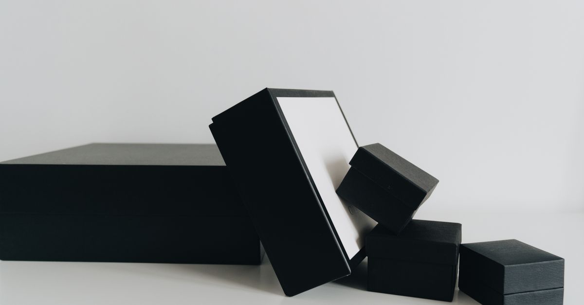 Sophisticated arrangement of black boxes on a clean white background for minimalist design.