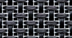 Detailed view of a black and white woven textile pattern in macro photography.