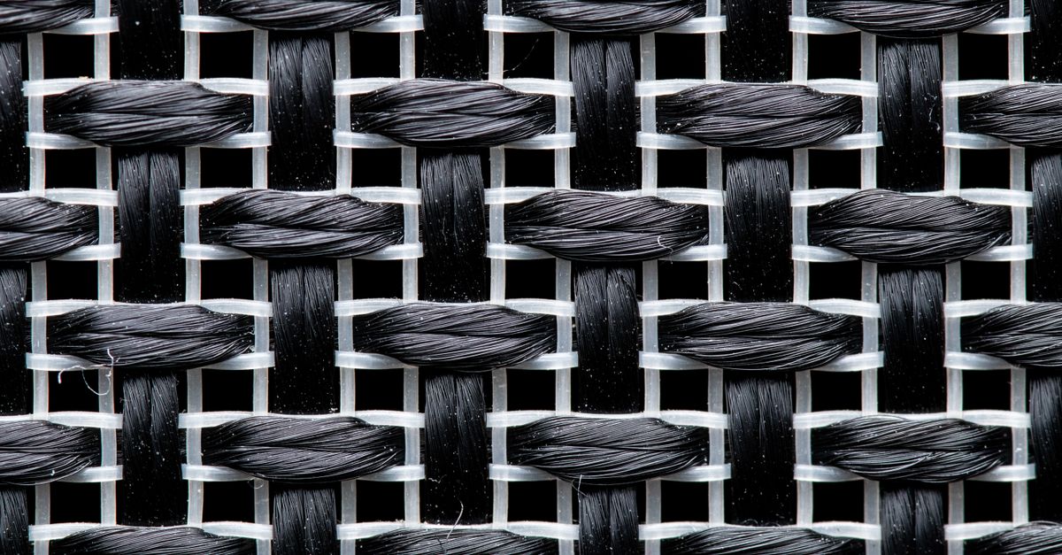 Detailed view of a black and white woven textile pattern in macro photography.